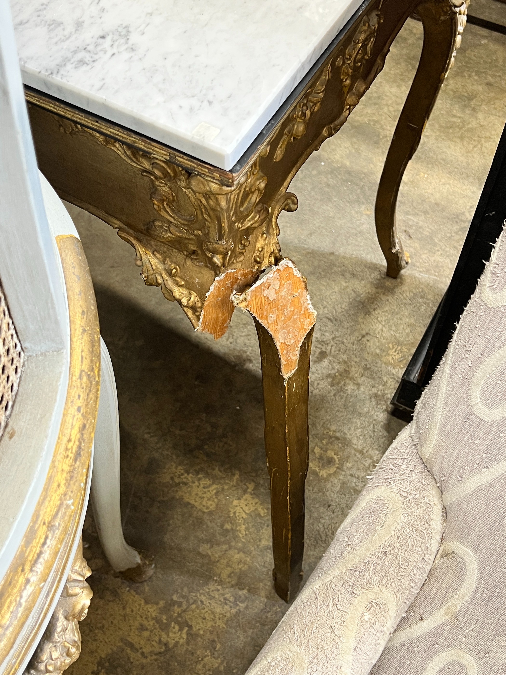 A giltwood and gesso marble topped side table, width 85cm, depth 57cm, height 80cm